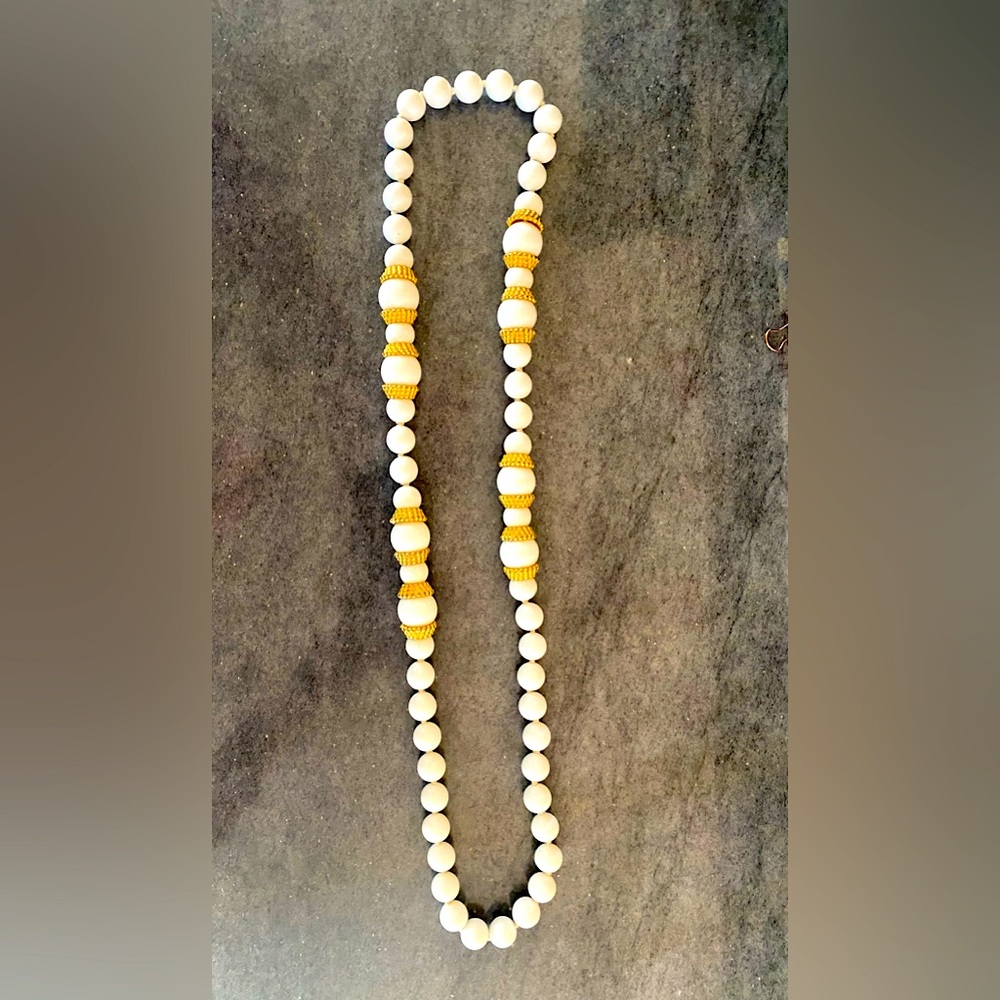 Vintage retro white and gold necklace. Adds a wow pop.